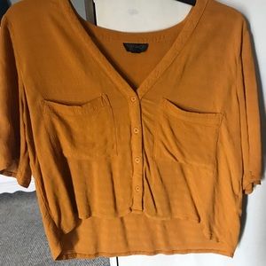 Burnt orange slightly cropped blouse.